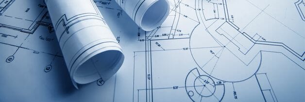 Blue CAD drawings laid out with engineering plans